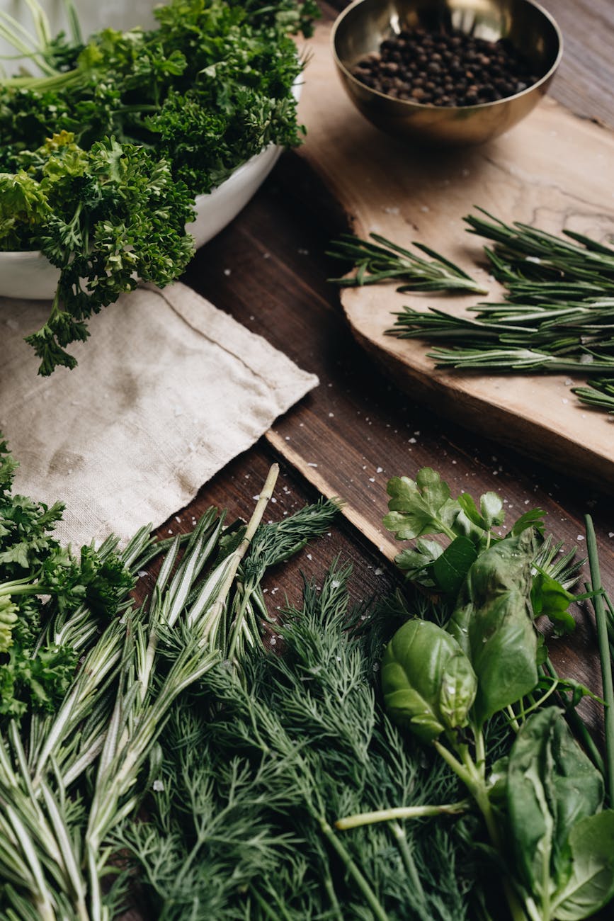 photo of assorted herbs on wooden surface